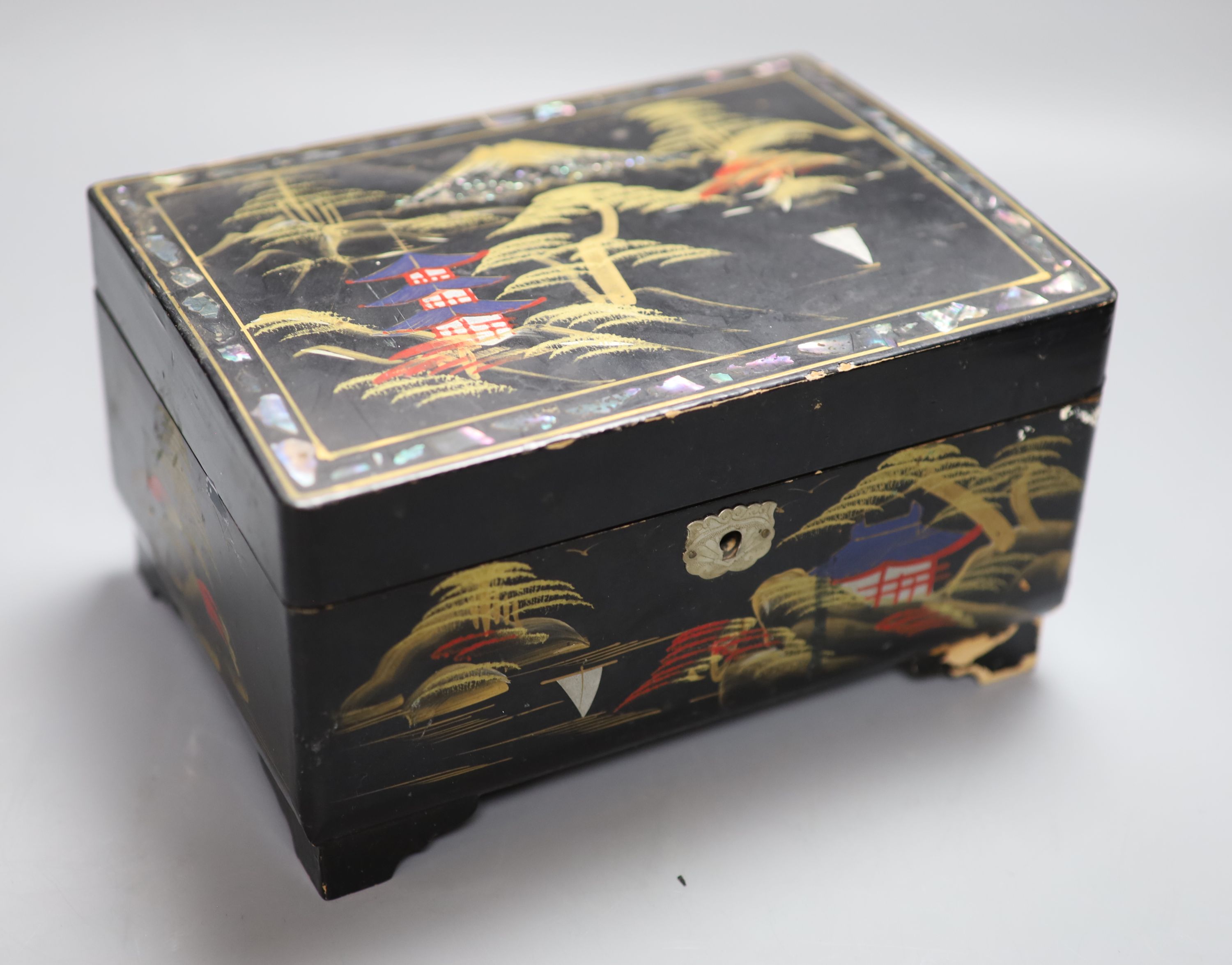 A pair of Chinese turquoise-glazed lion dogs, a lacquered jewellery box and three plated miniature figures